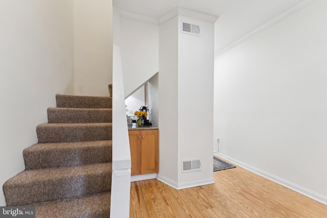 1215 Walter St SE, Washington, DC 20003 - stairway featuring wood finished floors, baseboards, and ornamental molding
