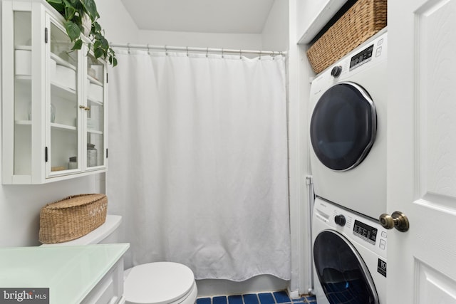 1215 Walter St SE, Washington, DC 20003 - bathroom featuring estacked washer and dryer, toilet, vanity, and a shower with curtain