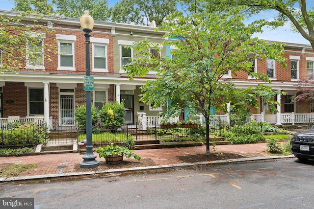 1215 Walter St SE, Washington, DC 20003 - view of property with brick siding and a porch