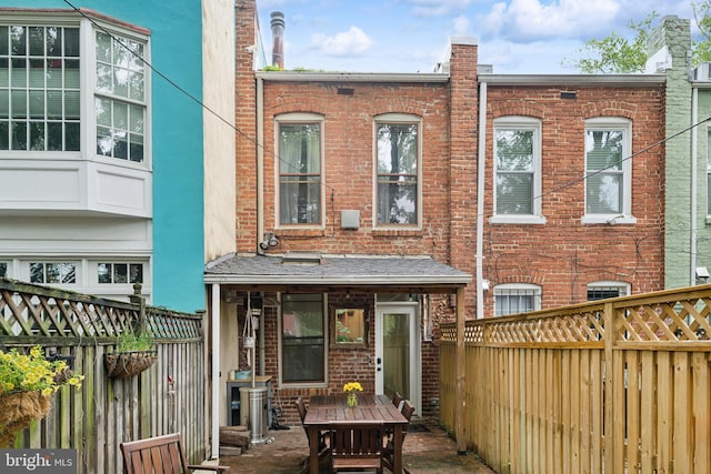 1215 Walter St SE, Washington, DC 20003 - back of house featuring brick siding and a fenced backyard