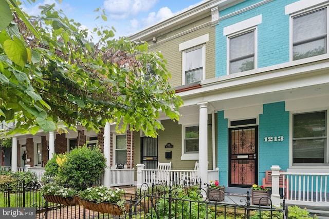 1215 Walter St SE, Washington, DC 20003 - view of property featuring brick siding and covered porch