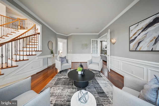 43582 Old Kinderhook Dr, Ashburn, VA 20147 - living area featuring wood finished floors, stairway, ornamental molding, and a wainscoted wall