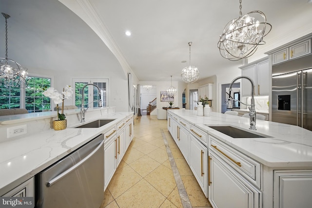 43582 Old Kinderhook Dr, Ashburn, VA 20147 - kitchen with a chandelier, stainless steel appliances, a sink, inlaid floor details, and recessed lighting