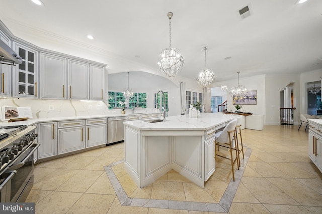 43582 Old Kinderhook Dr, Ashburn, VA 20147 - kitchen featuring a chandelier, appliances with stainless steel finishes, a sink, recessed lighting, and glass insert cabinets