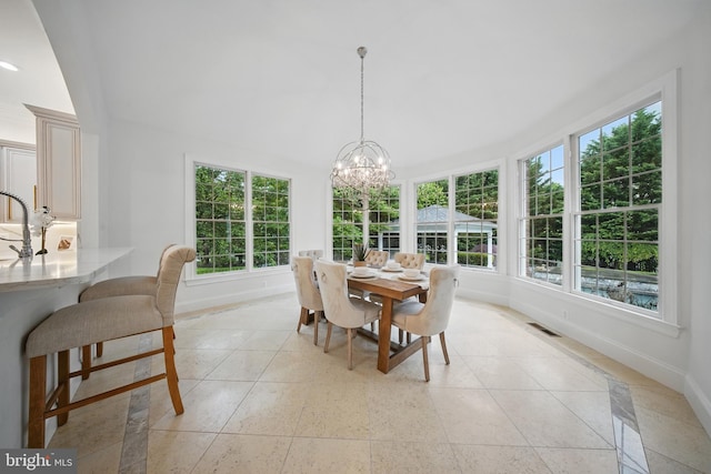 43582 Old Kinderhook Dr, Ashburn, VA 20147 - dining space with baseboards, plenty of natural light, a chandelier, and light tile patterned floors