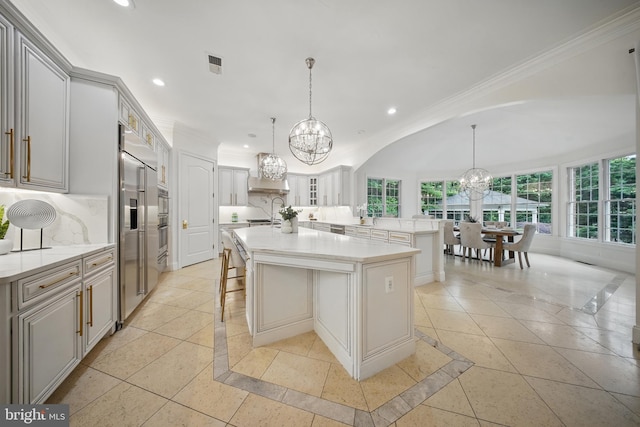 43582 Old Kinderhook Dr, Ashburn, VA 20147 - kitchen featuring a chandelier, inlaid floor details, recessed lighting, ornamental molding, and a center island