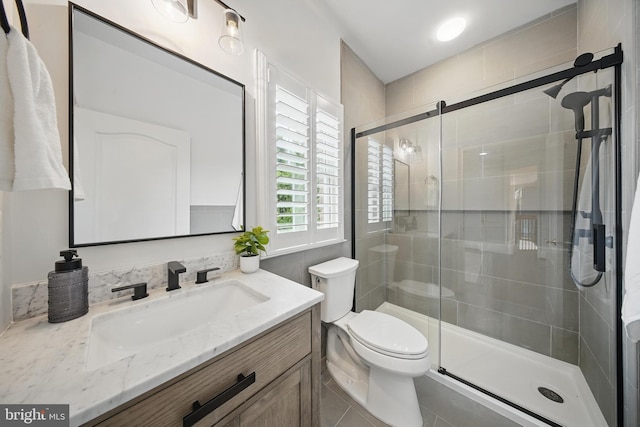 43582 Old Kinderhook Dr, Ashburn, VA 20147 - full bath featuring vanity, toilet, a stall shower, and tile patterned flooring