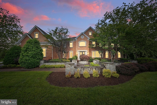 43582 Old Kinderhook Dr, Ashburn, VA 20147 - colonial home featuring a front lawn and brick siding