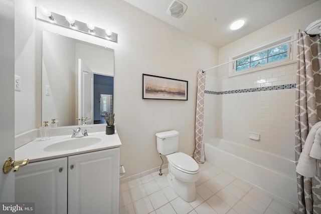 43582 Old Kinderhook Dr, Ashburn, VA 20147 - full bathroom featuring vanity, shower / bath combo with shower curtain, tile patterned flooring, toilet, and baseboards