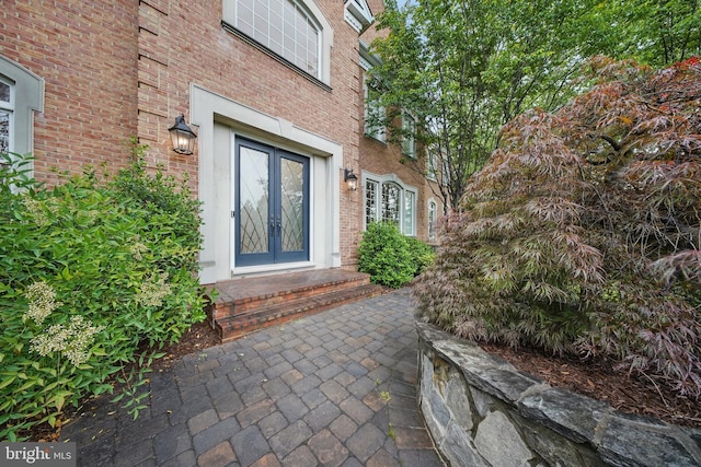 43582 Old Kinderhook Dr, Ashburn, VA 20147 - doorway to property featuring french doors and brick siding