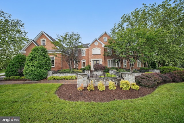 43582 Old Kinderhook Dr, Ashburn, VA 20147 - colonial-style house with a front yard and brick siding