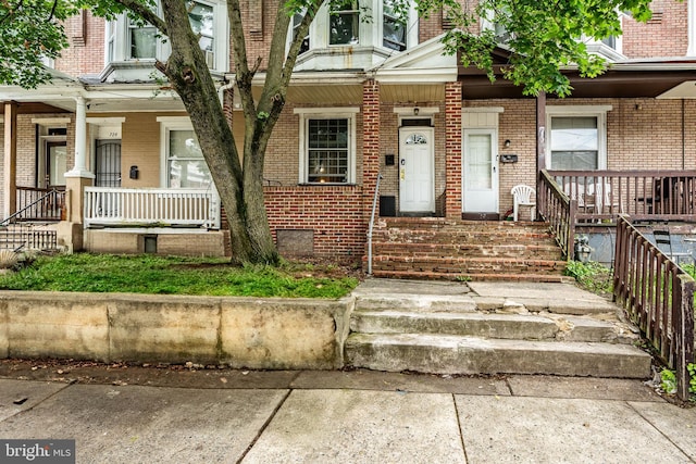 722 E 22nd St, Wilmington, DE 19802 - property entrance with a porch and brick siding