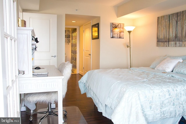bedroom featuring dark wood-style floors, a desk, and recessed lighting