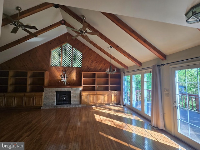 3450 Middle Ridge Rd, Newport, PA 17074 - unfurnished living room featuring hardwood / wood-style floors, a ceiling fan, wooden walls, a fireplace, and beam ceiling