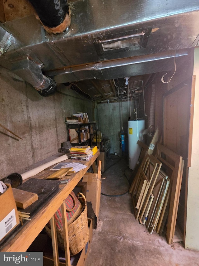 3450 Middle Ridge Rd, Newport, PA 17074 - unfinished below grade area featuring water heater and a workshop area