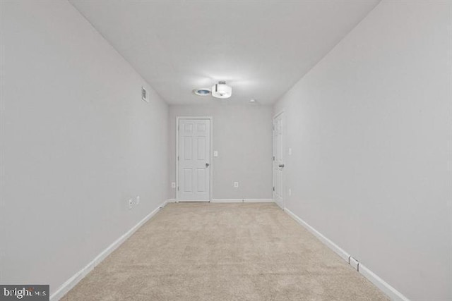 1224 James St, Baltimore, MD 21223 - empty room featuring light colored carpet and baseboards