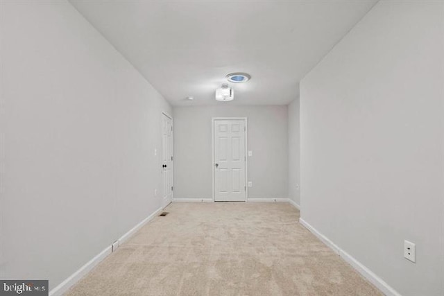 1224 James St, Baltimore, MD 21223 - empty room featuring light colored carpet and baseboards