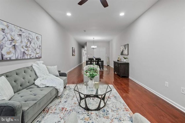 1224 James St, Baltimore, MD 21223 - living area with a chandelier, wood finished floors, a ceiling fan, recessed lighting, and baseboards