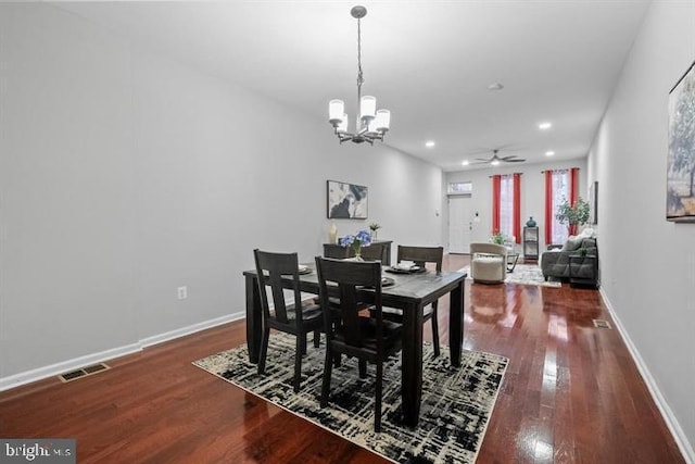 1224 James St, Baltimore, MD 21223 - dining area with ceiling fan, a chandelier, dark wood finished floors, baseboards, and recessed lighting