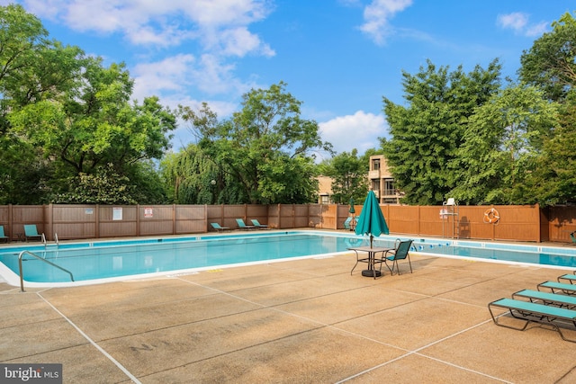1250 4th St SW Unit W203, Washington, DC 20024 - community pool with a patio area and view of scattered trees