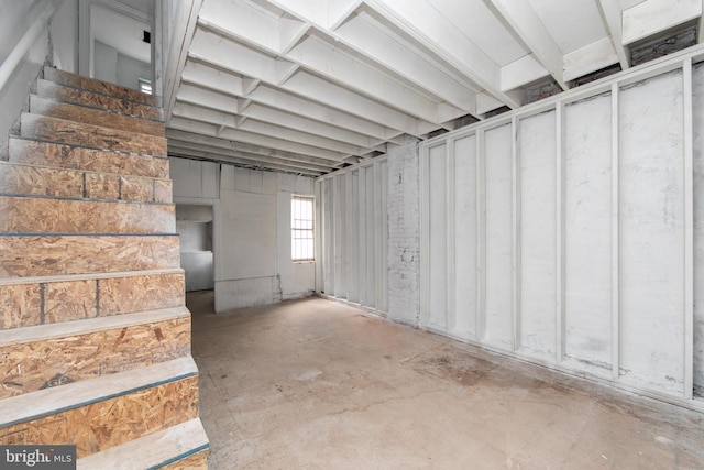 basement featuring stairs