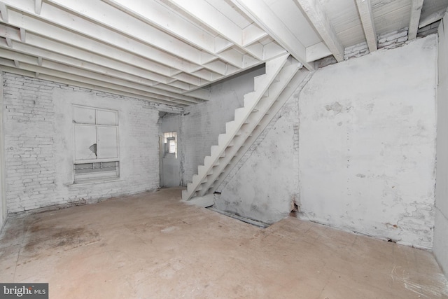 basement featuring stairs
