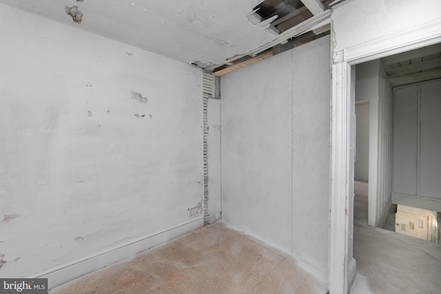 empty room featuring unfinished concrete floors