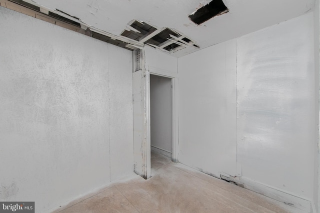 empty room featuring unfinished concrete floors