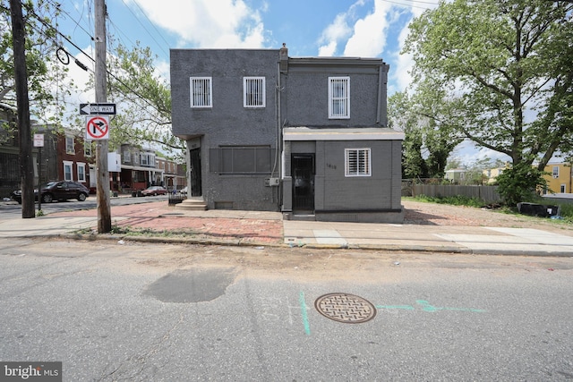 view of front of house featuring fence