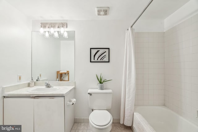 full bathroom with tile patterned flooring, shower / bathtub combination with curtain, toilet, vanity, and baseboards
