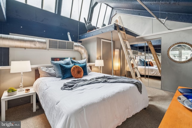 bedroom featuring carpet flooring, a towering ceiling, and a closet