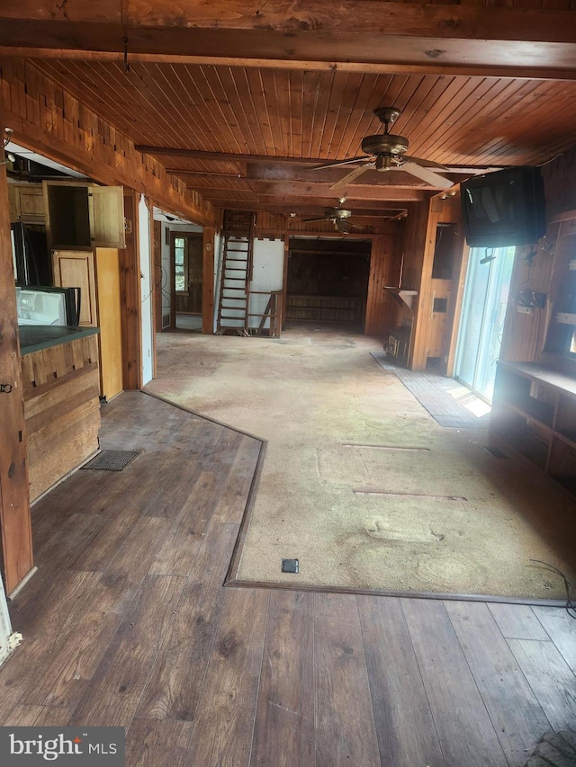 5573 Rte 9, Tuckerton, NJ 08087 - unfurnished living room with a ceiling fan, wood walls, wooden ceiling, wood-type flooring, and stairs