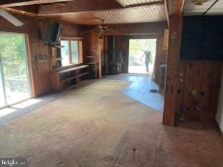 5573 Rte 9, Tuckerton, NJ 08087 - unfurnished living room featuring wooden walls, ceiling fan, and carpet flooring