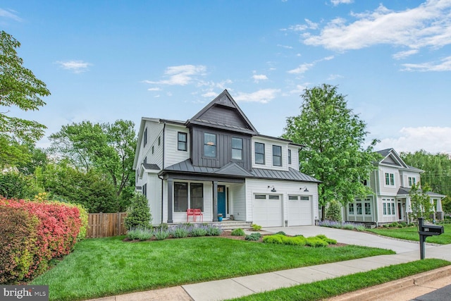 302 Jade Ct NW, Vienna, VA 22180 - view of front of property featuring concrete driveway, a standing seam roof, covered porch, a garage, and metal roof