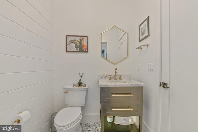 302 Jade Ct NW, Vienna, VA 22180 - bathroom with toilet, vanity, and baseboards