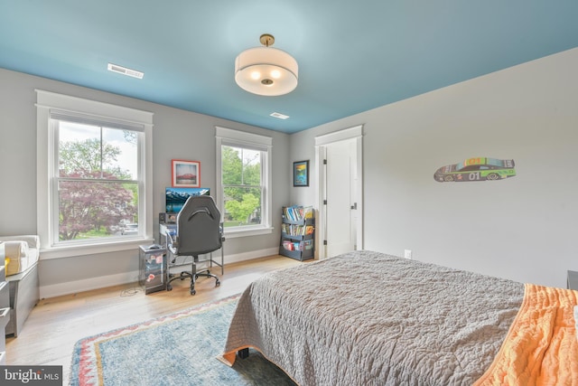 302 Jade Ct NW, Vienna, VA 22180 - bedroom featuring wood finished floors, baseboards, and a desk