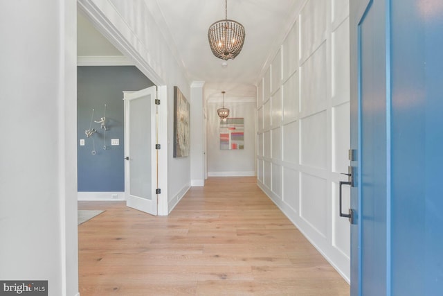 302 Jade Ct NW, Vienna, VA 22180 - foyer with a chandelier, light wood finished floors, and baseboards