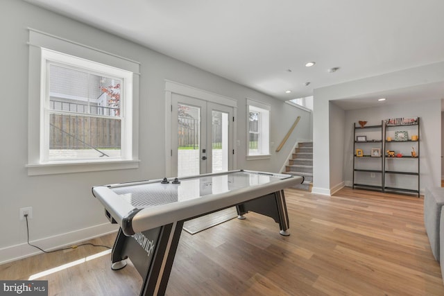 302 Jade Ct NW, Vienna, VA 22180 - playroom featuring baseboards, recessed lighting, light wood-type flooring, and french doors