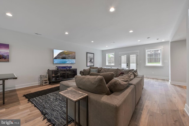 302 Jade Ct NW, Vienna, VA 22180 - living room with light wood finished floors, baseboards, and recessed lighting