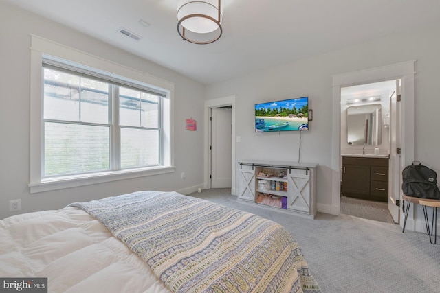 302 Jade Ct NW, Vienna, VA 22180 - bedroom featuring light carpet, a sink, baseboards, and ensuite bathroom