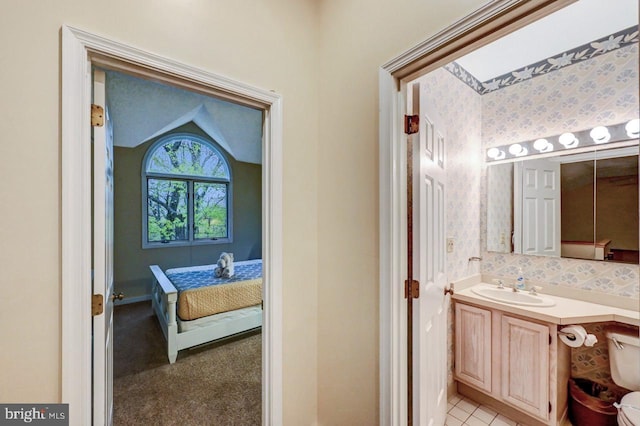 bathroom with vanity and connected bathroom