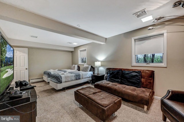 carpeted bedroom featuring a baseboard radiator and baseboards