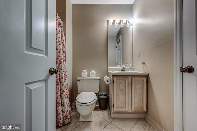 full bathroom with tile patterned flooring, toilet, and vanity