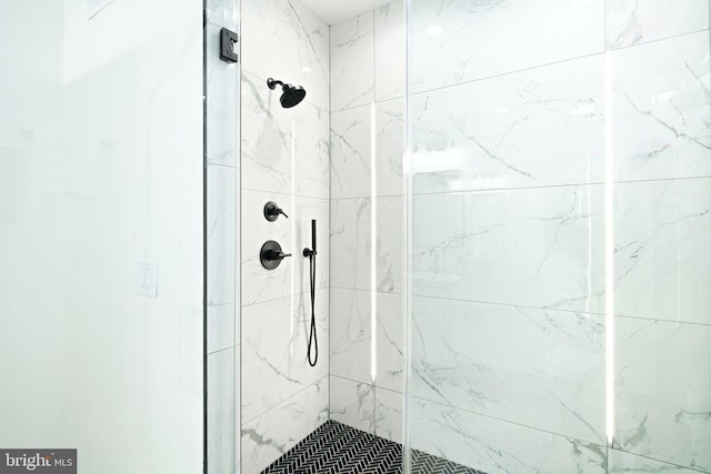 bathroom with a shower stall