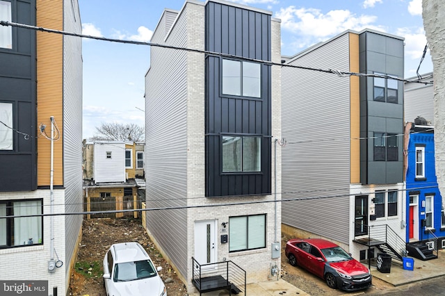 view of side of property featuring brick siding