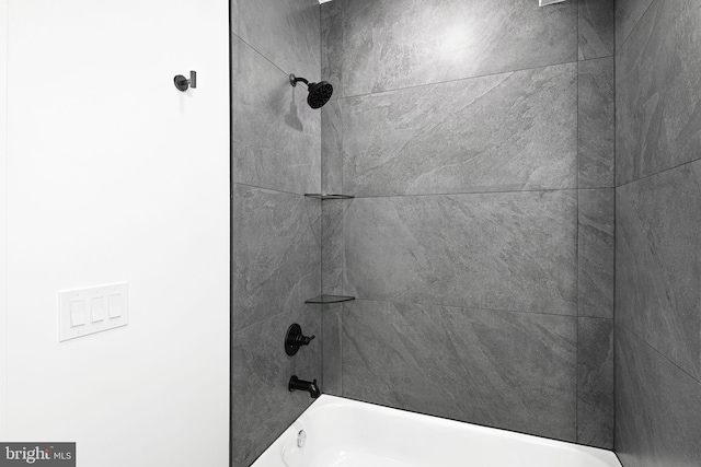 bathroom view of shower / tub combination