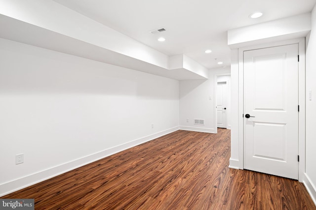 additional living space featuring wood finished floors, baseboards, and recessed lighting