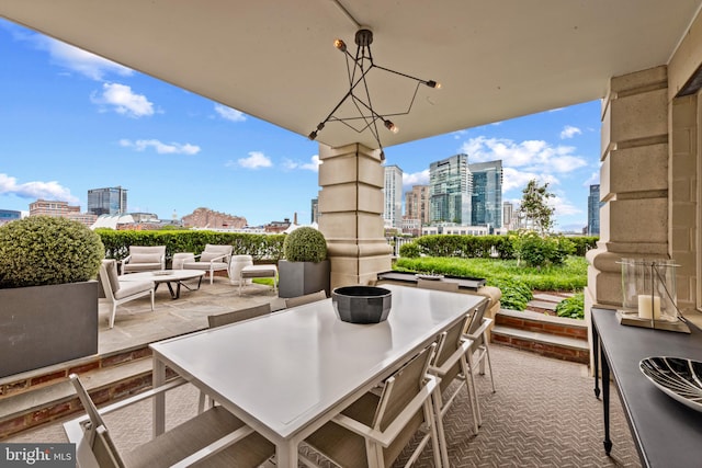 801 Key Hwy Unit 110, Baltimore, MD 21230 - view of patio with a view of skyline and outdoor dining space