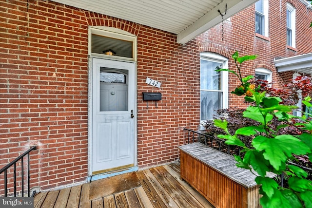 entrance to property with brick siding