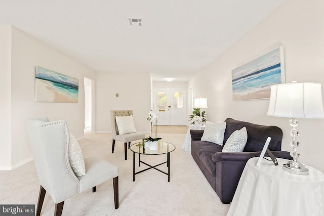 living room featuring carpet floors and baseboards